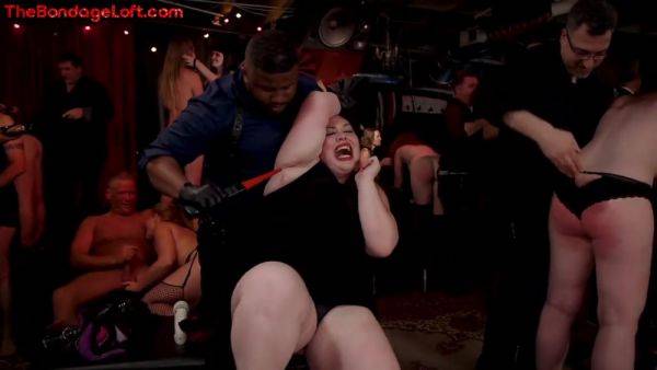 Busty BDSM public redhead whipped in front of voyeurs on cooltits.com